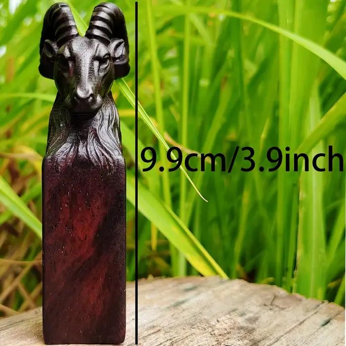 Ornement sculpté en forme de tête de mouton