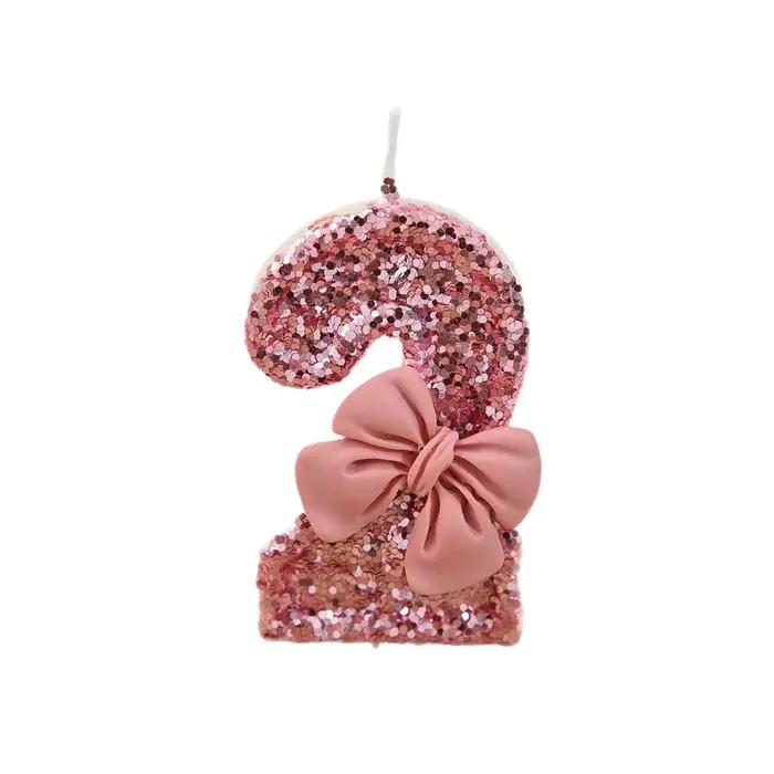 Bougie créative à paillettes scintillantes avec nœud rose pour gâteau d'anniversaire célébration festive élégante occasions spéciales