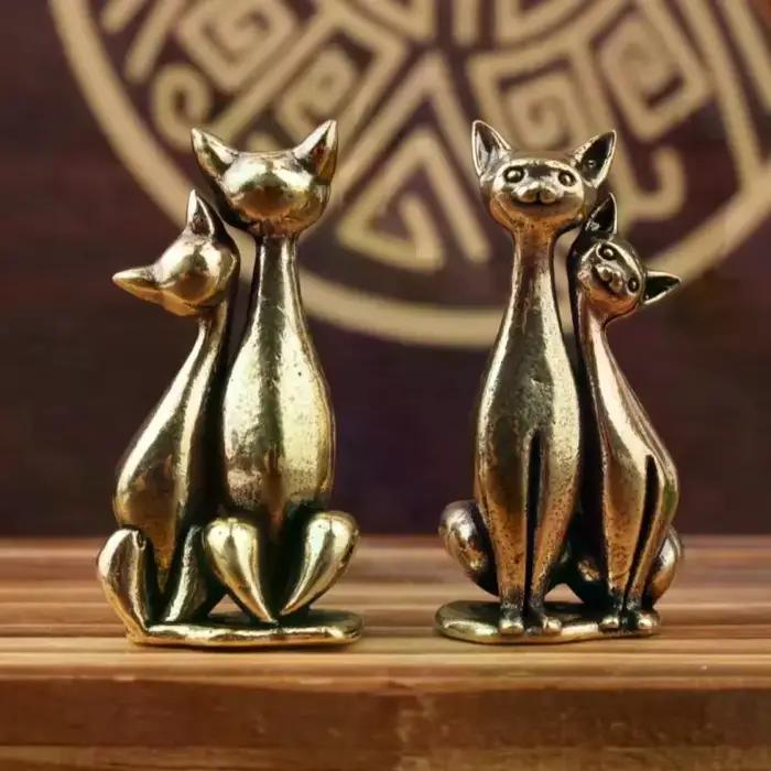 Sculpture de chat double en laiton