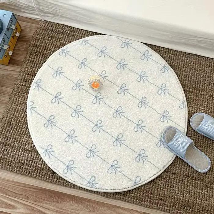 Tapis rond doux et moelleux bleu avec nœud papillon