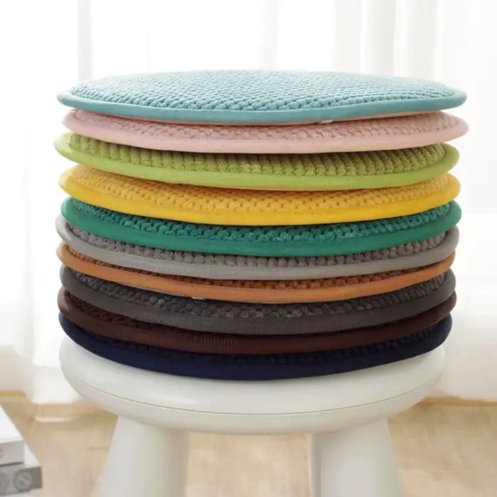 Coussin rond de couleur unie