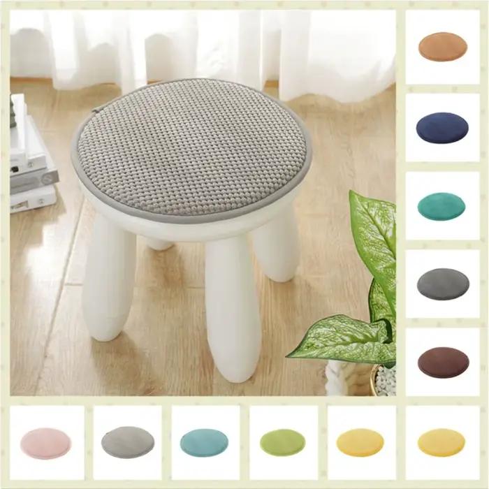 Coussin rond de couleur unie