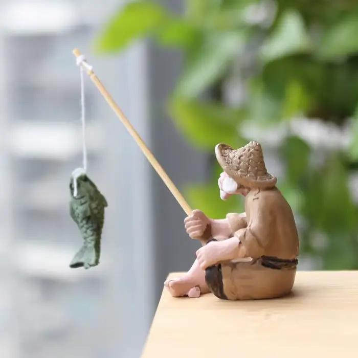 Statue en résine de vieil homme pêcheur