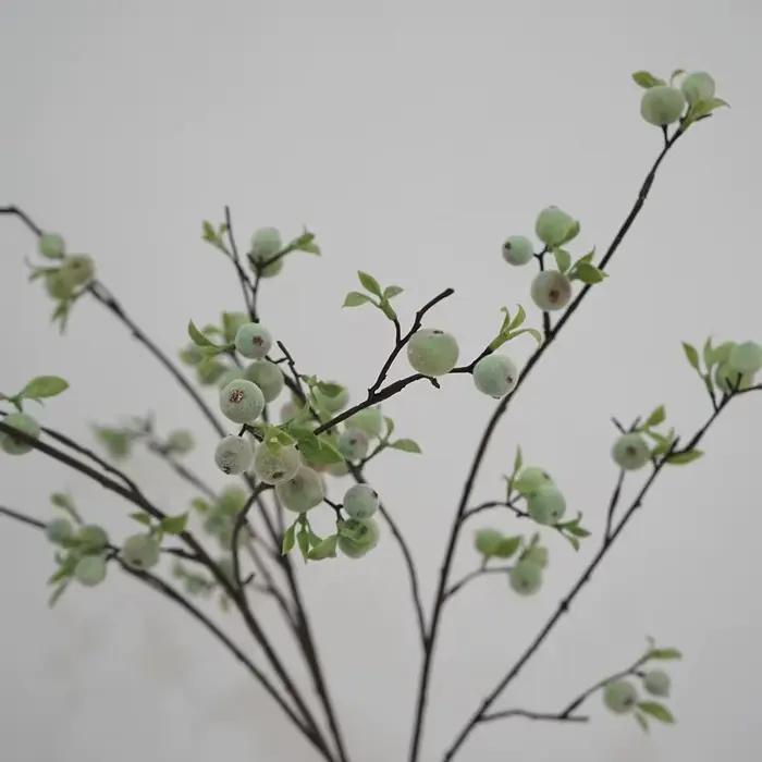 Branche de fleurs de baies pour la décoration de la maison