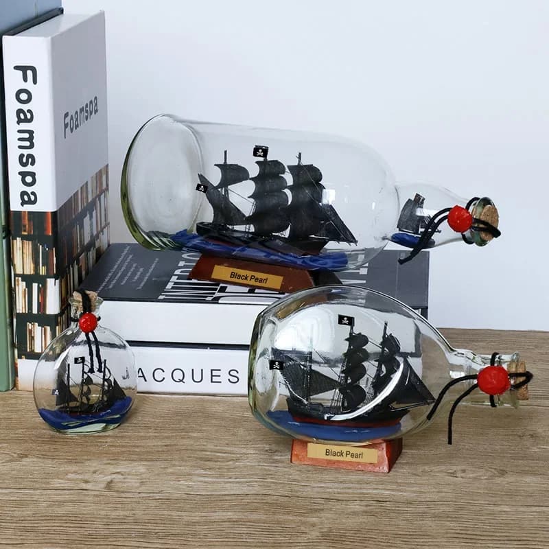 Bouteille de souhait en verre à la dérive avec perles noires